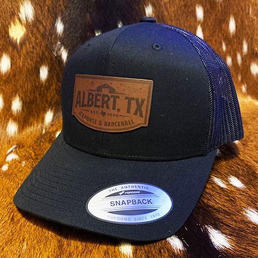YUPOONG ALBERT LEATHER PATCH TRUCKER HAT - BLACK
